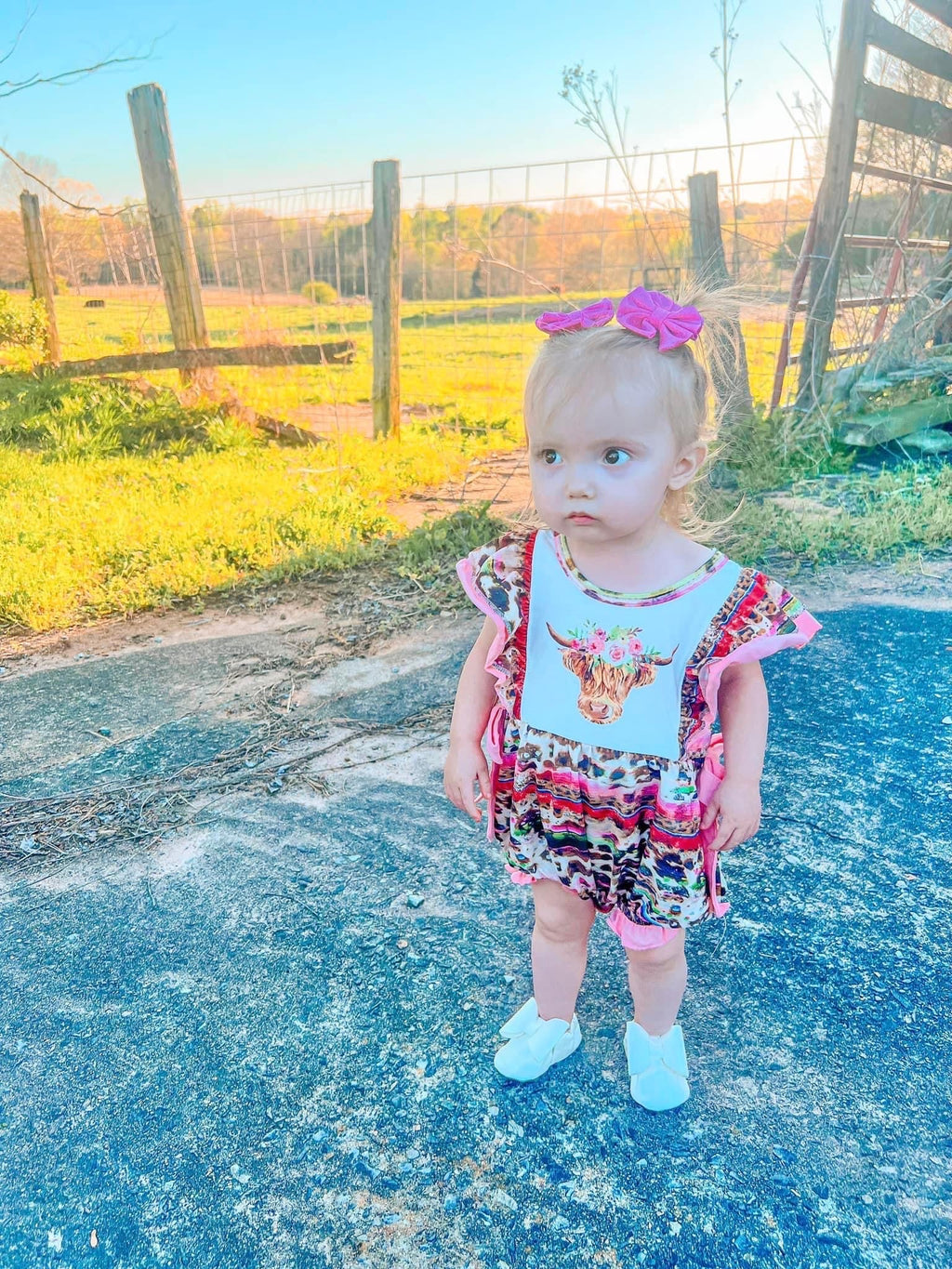 Pink serape cow romper