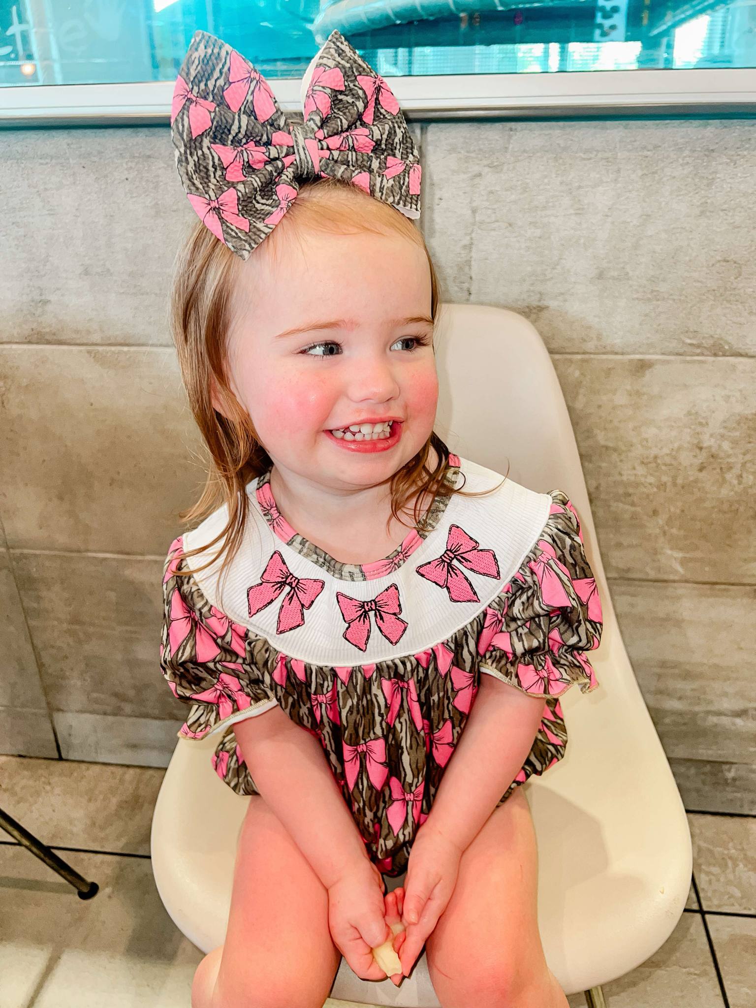 Smocked camo bows romper