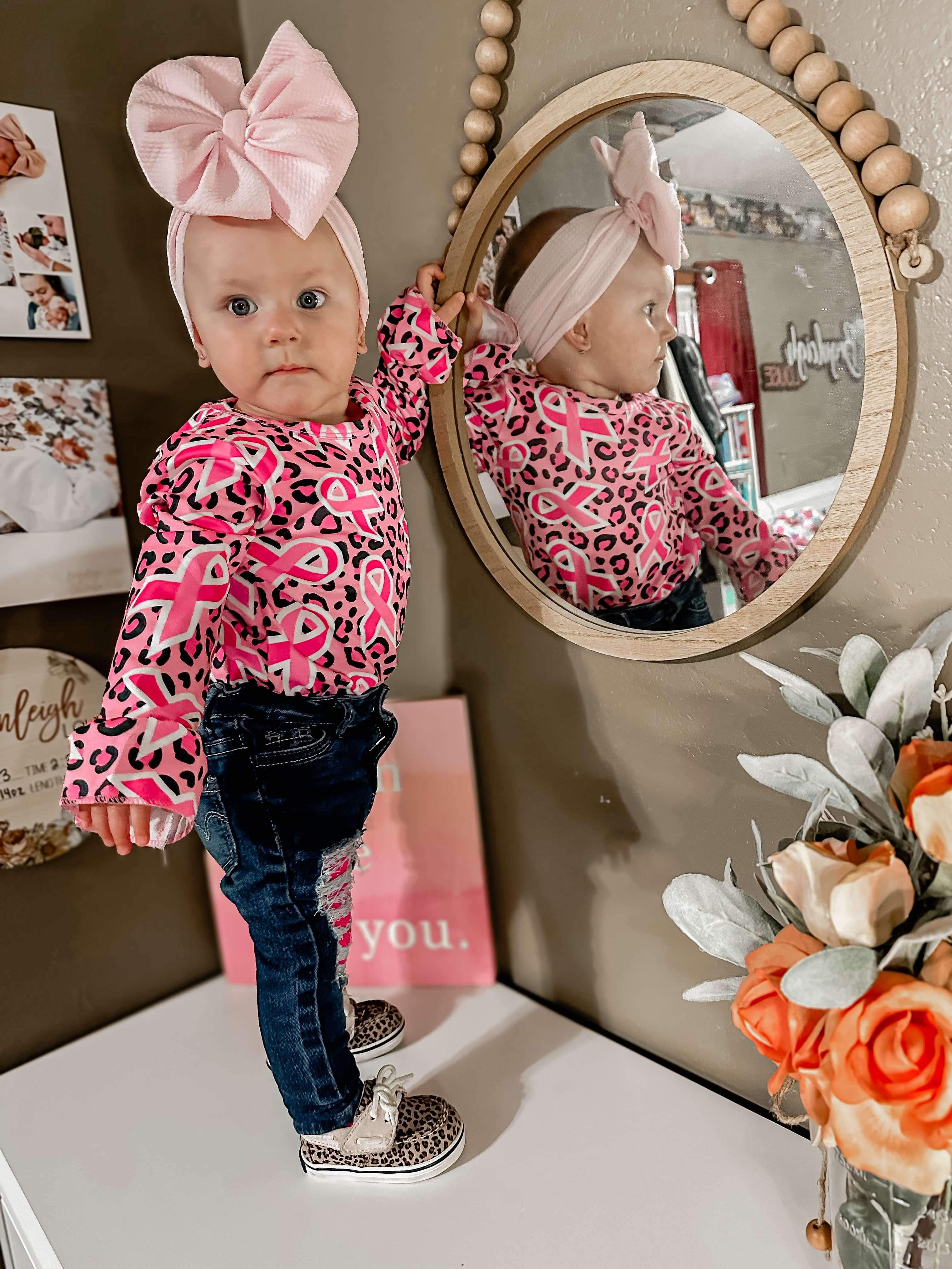 We wear pink sleeve bell leo only